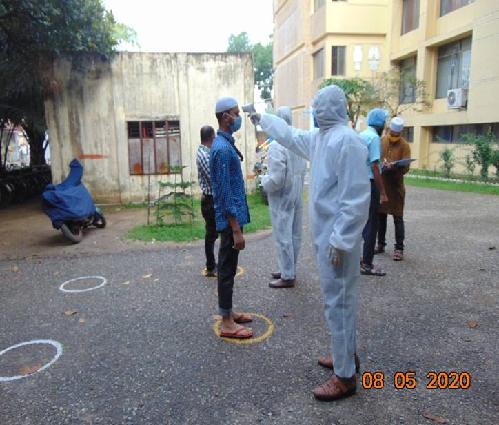 Factory workers in Bangladesh having their temperature checked