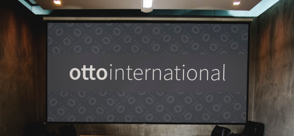 Our Rebranding 3 Portraying the Otto International logo on a projector screen